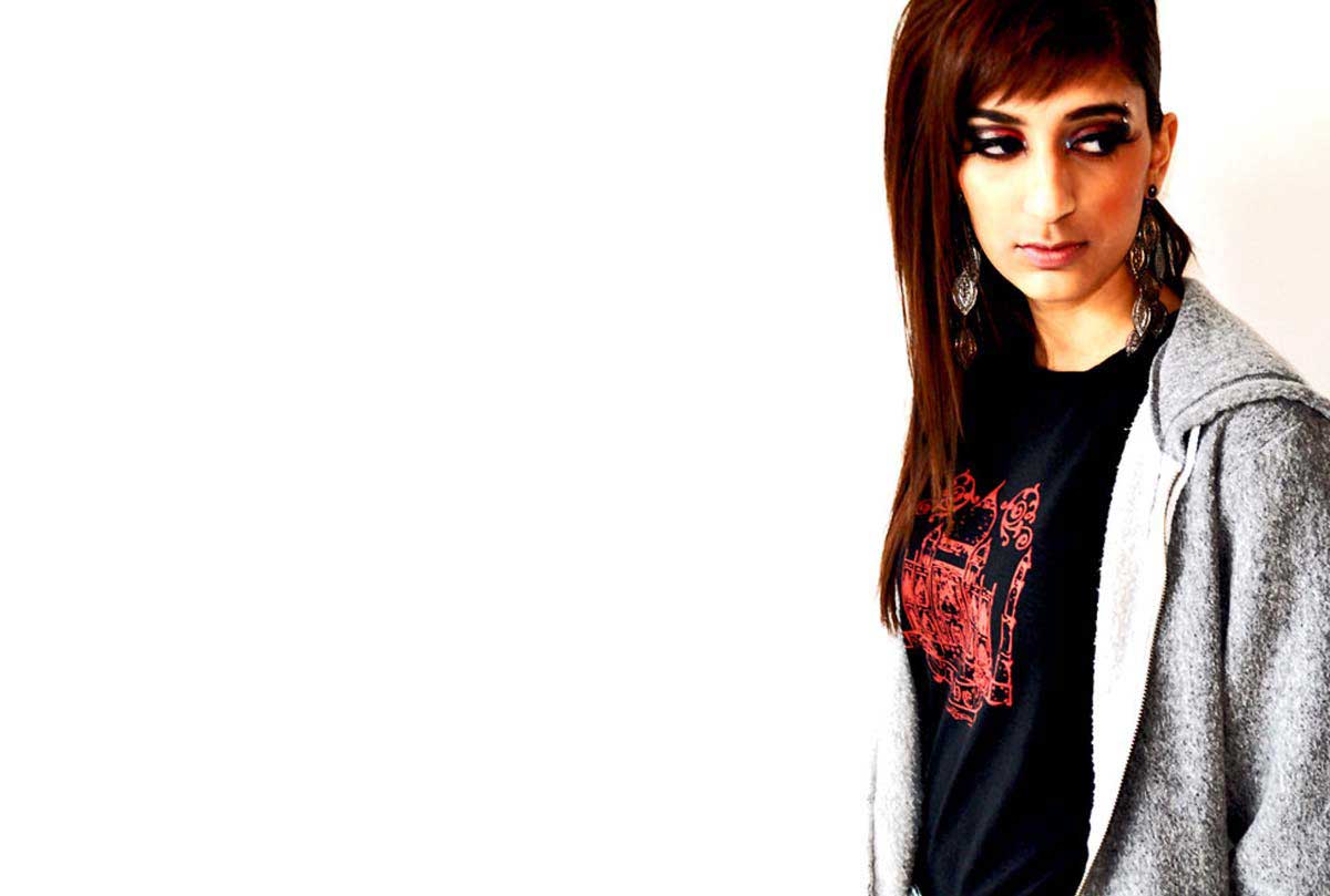 South Asian Female Model Wearing Graphic Design Tshirt with image of Taj Mahal on front.